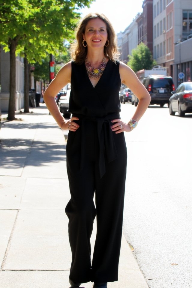 jumpsuit with bold jewelry